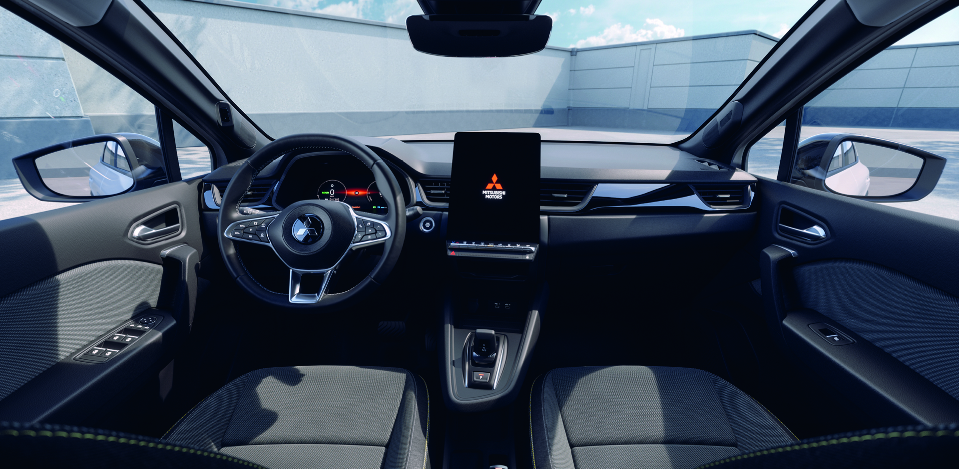 Mitsubishi Grandis Intro Edition Innenraum-Ansicht mit schwarzen Sitzen, digitalem Cockpit, großem Touchscreen-Display und modernem Lenkrad